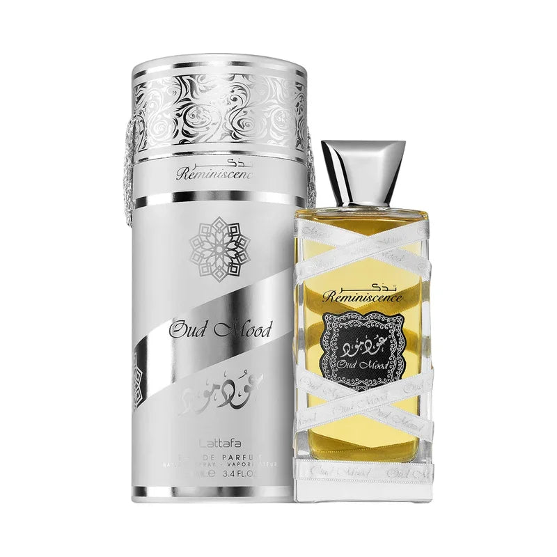Parfum Oud Mood Reminiscence de Lattafa dans son flacon et étui argenté