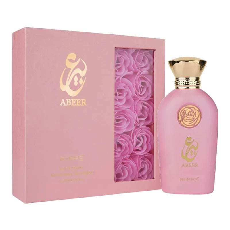 Coffret parfum Abeer rose avec flacon élégant et décoration de roses décoratives.