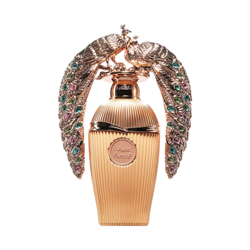 Flacon de parfum luxe doré avec paon orné de pierres précieuses, design élégant et raffiné