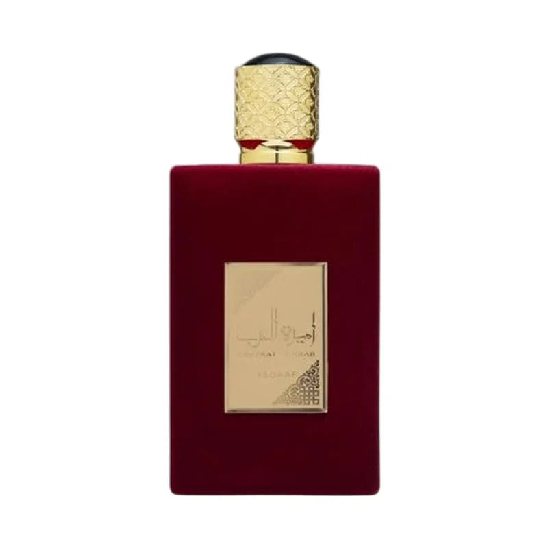 Flacon de parfum de luxe en velours rouge avec bouchon doré ornementé