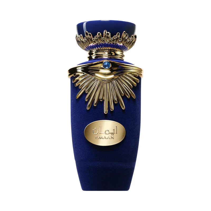 Flacon de parfum bleu nuit Emaan avec détails dorés sculptés et motif œil de soleil.