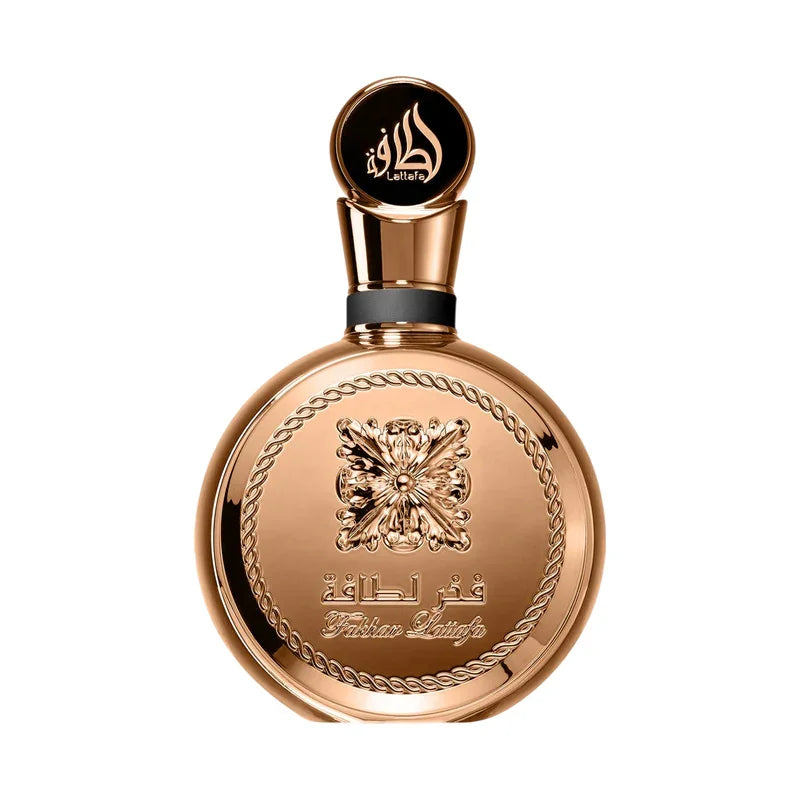 Flacon de parfum Fakhar Lattafa doré avec détails ciselés et bouchon ornementé