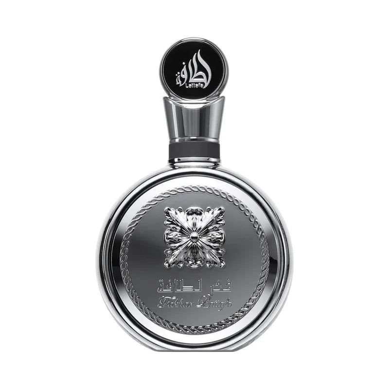 Flacon de parfum luxe métallique avec motif floral et inscriptions arabes, design élégant et raffiné