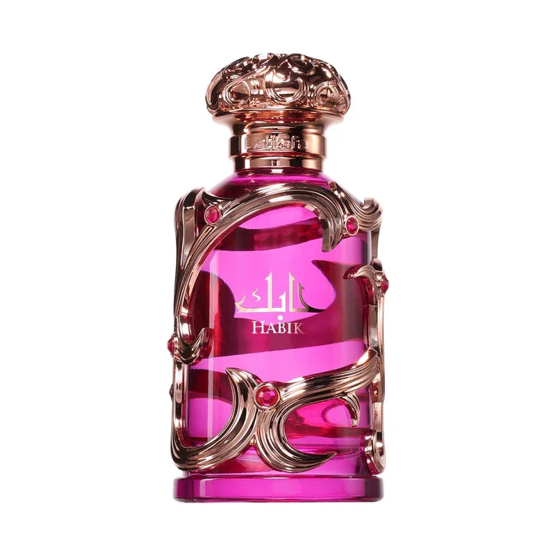 Flacon de parfum Habik rose doré, design luxueux avec détails ornés et pierres rouges
