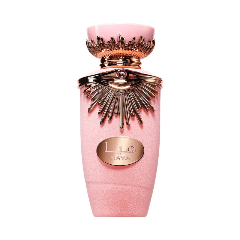Flacon de parfum rose poudré avec détails dorés et logo HAYA, design luxueux et élégant