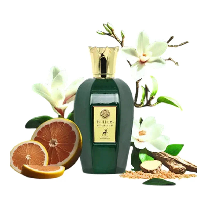 Flacon de parfum vert avec fleurs de magnolia et tranches de pamplemousse