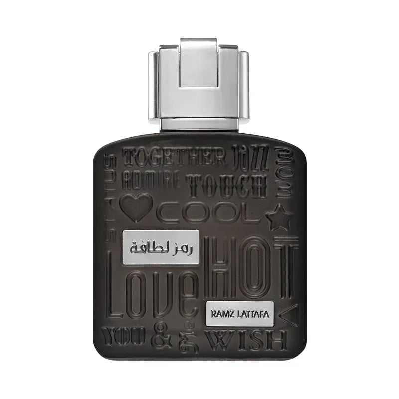 Flacon de parfum noir Ramz Lattafa avec inscriptions textuelles et motifs graphiques