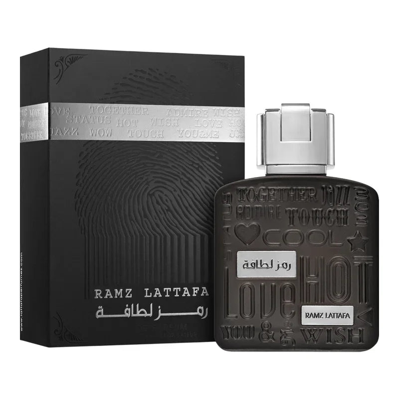 Parfum Ramz Lattafa pour homme dans son coffret noir élégant avec motifs texturés.
