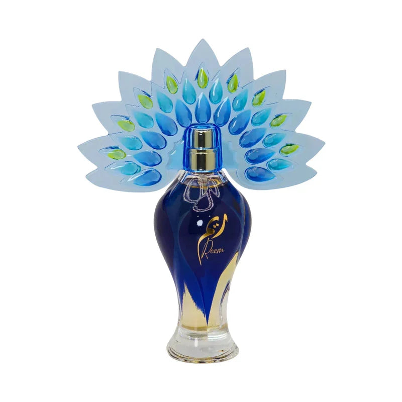 Flacon de parfum Reem bleu avec ailes de paon, design élégant et doré